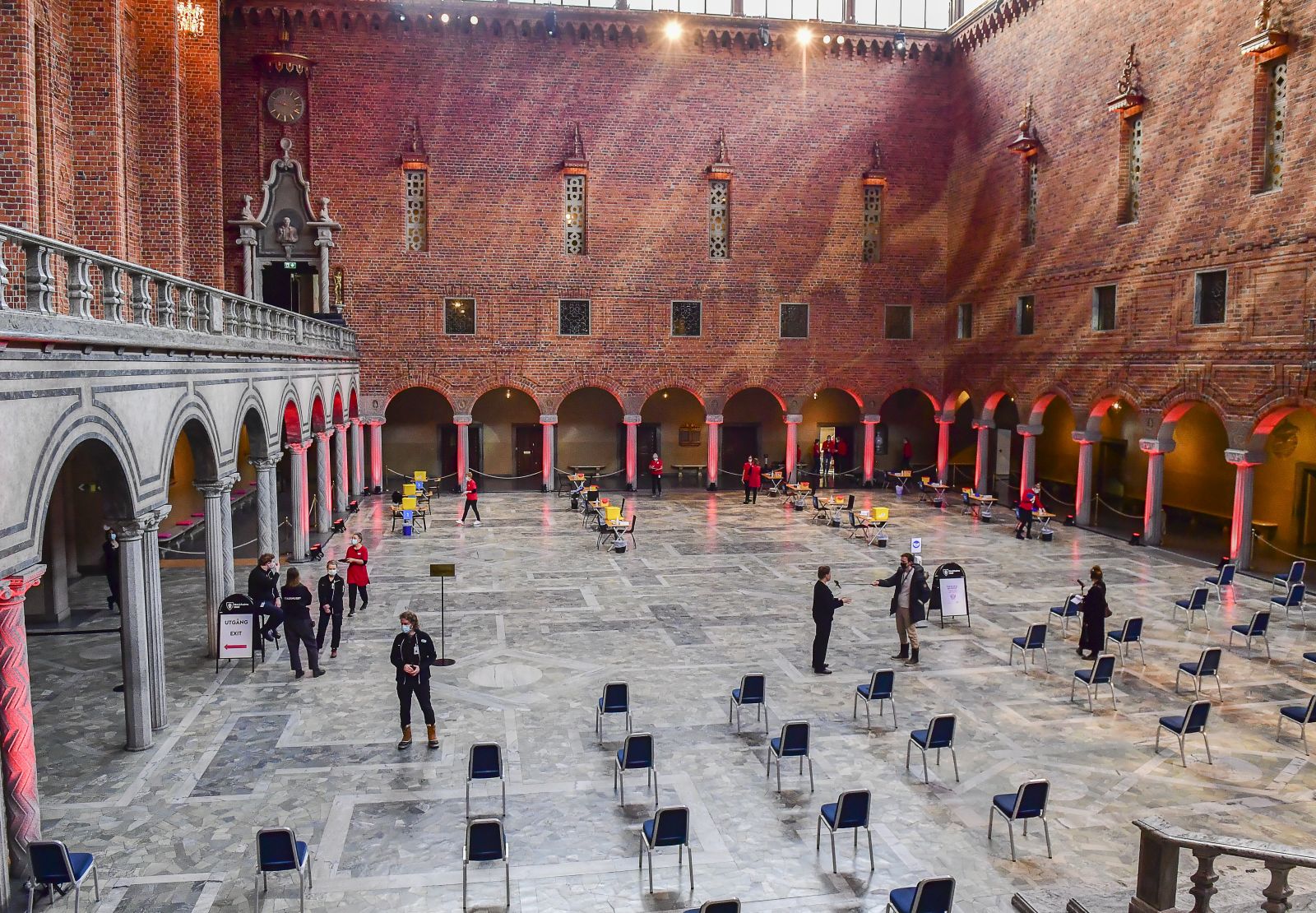 epa09027413 Nursing staff prepare the desks for a day of mass vaccination against Covid-19 in the Blue Hall of the Stockholm City Hall, the venue for the Nobel Prize banquets, in Stockholm, Sweden, 21 February 2021.  EPA/Jonas Ekströmer SWEDEN OUT SWEDEN OUT