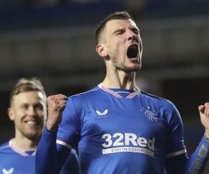 epa09036556 Borna Barisic of Rangers celebrates after scoring the 4-2 lead from the penalty spot during the UEFA Europa League round of 32, second leg soccer match between Glasgow Rangers and Royal Antwerp FC in London, Britain, 25 February 2021.  EPA/Ian McNicol / POOL
