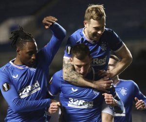 epa09036557 Borna Barisic (C) of Rangers celebrates with teammates after scoring the 4-2 lead from the penalty spot during the UEFA Europa League round of 32, second leg soccer match between Glasgow Rangers and Royal Antwerp FC in London, Britain, 25 February 2021.  EPA/Ian McNicol / POOL