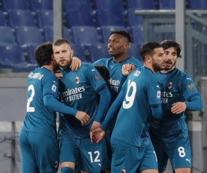 epa09043595 Milan's Ante Rebic (2-L) celebrates with his teammates after scoring the 2-1 lead during the Italian Serie A soccer match between AS Roma and AC Milan at the Olimpico stadium in Rome, Italy, 28 February 2021.  EPA/GIUSEPPE LAMI