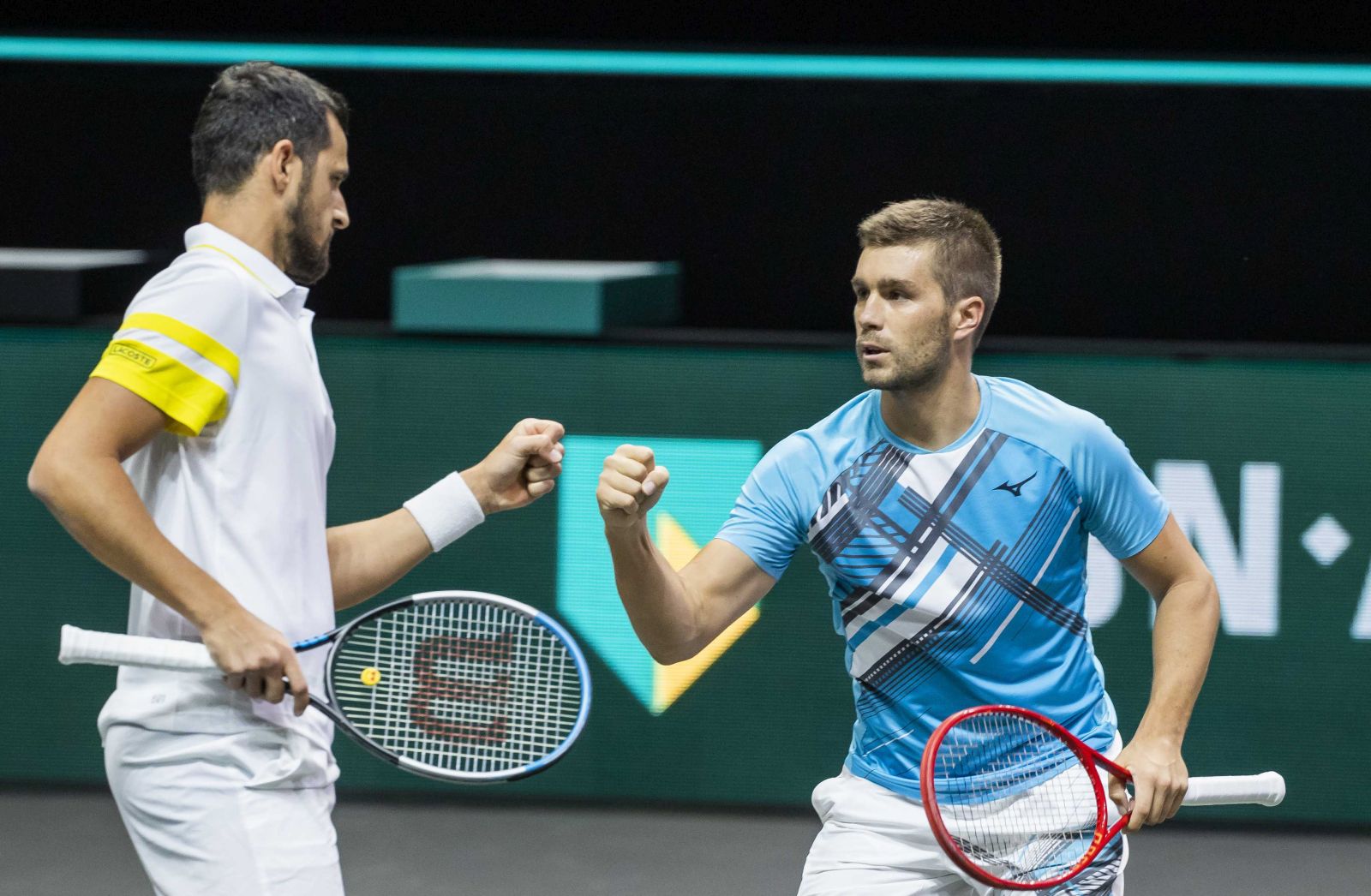 epa09046602 Mate Pavic (L) and Nikola Mektic of Croatia in action against Robin Haase and Matwe Middelkoop on the second day of the ABN AMRO World Tennis Tournament in Rotterdam, The Netherlands, 02 March 2021. The ATP tournament in Ahoy takes place without an audience due to the corona pandemic.  EPA/KOEN SUYK