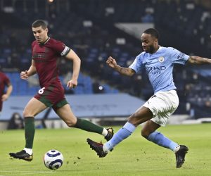 epa09047101 Manchester City's Raheem Sterling (R) in action during the English Premier League soccer match between Manchester City and Wolverhampton Wanderers in Manchester, Britain, 02 March 2021.  EPA/Paul Ellis / POOL EDITORIAL USE ONLY. No use with unauthorized audio, video, data, fixture lists, club/league logos or 'live' services. Online in-match use limited to 120 images, no video emulation. No use in betting, games or single club/league/player publications.