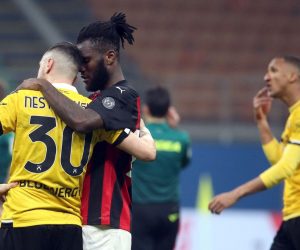 epa09050128 Udinese’s Ilija Nestorovski (L) and AC Milan’s Franck Kessie (2-L) react during the Italian Serie A soccer match between AC Milan and Udinese at Giuseppe Meazza stadium in Milan, Italy, 03 March 2021.  EPA/MATTEO BAZZI