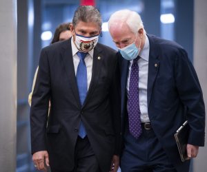 epa09054859 Democratic Senator from West Virginia Joe Manchin (L) and Republican Senator from Texas John Cornyn (R) walk to the Senate chamber as the Senate begins a so-called 'vote-a-rama' on more than 40 amendments to President Biden's Covid relief package in the US Capitol in Washington, DC, USA, 05 March 2021. Once the Senate finishes with their marathon reconciliation process, they can vote on the final package.  EPA/JIM LO SCALZO
