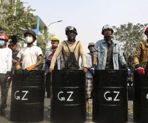 epa09064766 Demonstrators stand with makeshift shields during a protest against the military coup in Mandalay, Myanmar, 10 March 2021. Myanmar security forces on 10 March raided a railway staff compound where railway workers were on strike as part of a civil disobedience movement against the military coup. Anti-coup protests continue in Myanmar amid intensifying violent crackdowns on demonstrators by security forces.  EPA/KAUNG ZAW HEIN