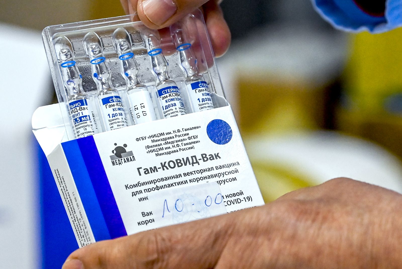 epa09065201 A nurse takes out from the box vials of the Russian Sputnik V vaccine against coronavirus - disease  (COVID-19) during vaccination at Jane Sandanski Polyclinic in Skopje, Republic of North Macedonia, 10 March 2021. North Macedonia continues its coronavirus disease (COVID-19) vaccination campaign of medical workers with Russian Sputnik V vaccine.  EPA/GEORGI LICOVSKI