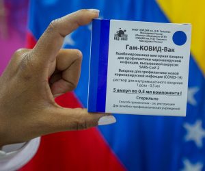 epa09069946 (FILE) A health worker of the Domingo Luciani hospital shows the Russian Sputnik V vaccine during a vaccination day against Covid-19 in Caracas, Venezuela, 04 March 2021 (issued 12 March). A year after the first cases of Covid-19 were detected in Venezuela, the number of infections continues to be one of the lowest in Latin America, with 144,277 people affected by the disease, which caused 1,415 deaths, according to official data. The figure is questioned by doctors and opponents who denounce an application of convenience tests in the midst of the weakened health system and given the lax quarantine like on celebration dates such as Christmas.  EPA/Miguel Gutierrez
