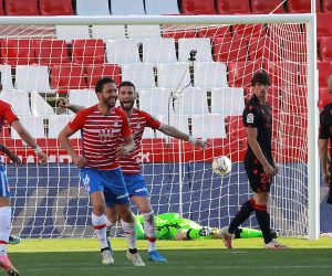 epa09074232 Granada's German Sanchez (C-L) celebrates with teammates after scoring the 1-0 lead during the Spanish La Liga soccer match between Granada CF and Real Sociedad in Granada, southern Spain, 14 March 2021.  EPA/Pepe Torres