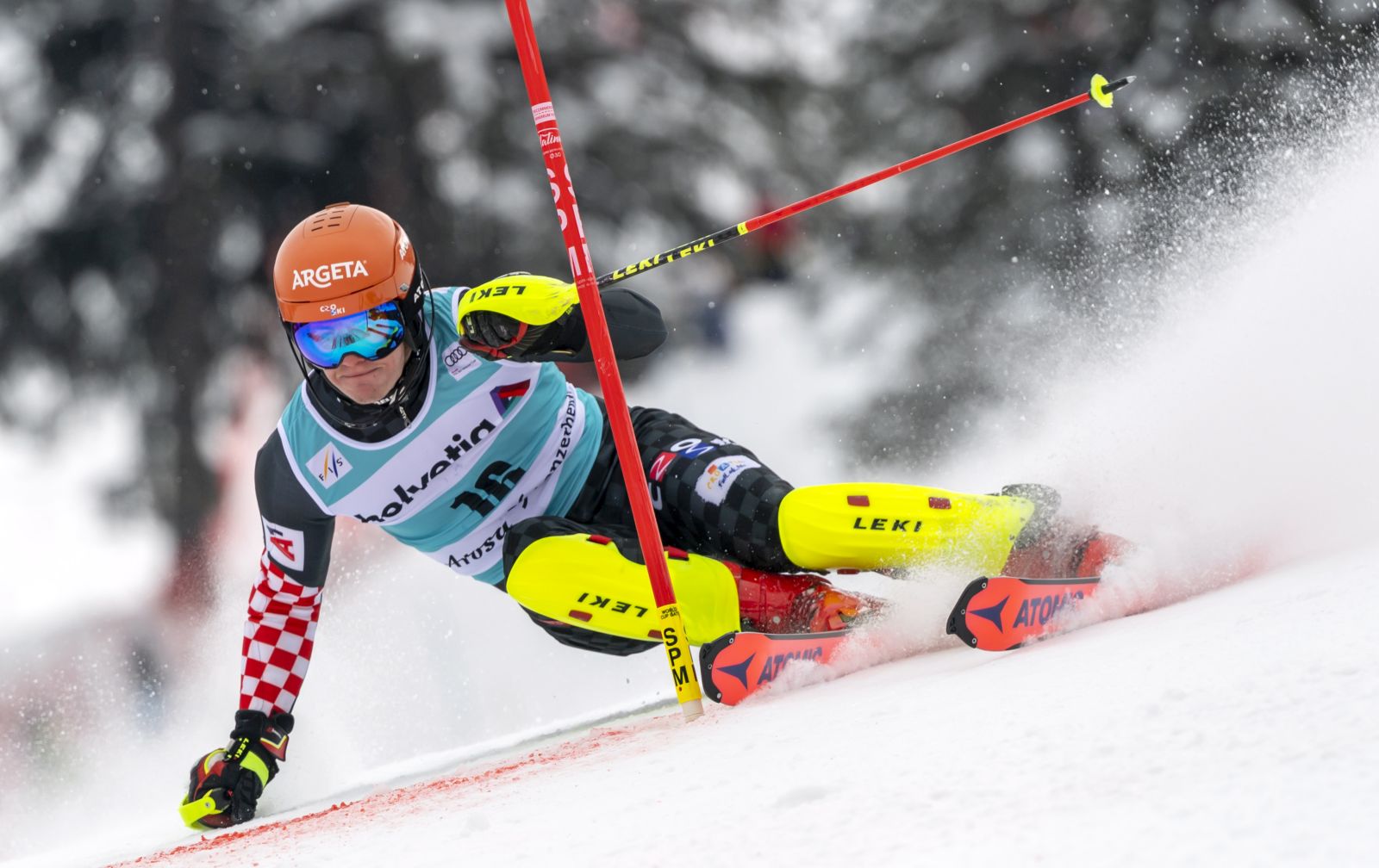epa09087455 Croatia's Filip Zubcic clears a gate during the first run of the Men's Slalom race at the FIS Alpine Skiing World Cup finals in Lenzerheide, Switzerland, 21 March 2021.  EPA/JEAN-CHRISTOPHE BOTT