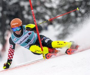 epa09087455 Croatia's Filip Zubcic clears a gate during the first run of the Men's Slalom race at the FIS Alpine Skiing World Cup finals in Lenzerheide, Switzerland, 21 March 2021.  EPA/JEAN-CHRISTOPHE BOTT
