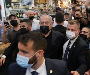 epa09089964 Israeli Prime Minister and leader of the Likud party Benjamin Netanyahu visits the Mahane Yehuda Market as part of his elections campaign in Jerusalem, Israel, 22 March 2021. Israel is expected to hold legislative elections on 23 March 2021 to elect the members of the 24th Knesset.  EPA/ABIR SULTAN