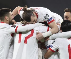 epa09094378 Hakan Calhanoglu of Turkey celebrates with team mates after scoring a goal during the FIFA World Cup 2022 qualification match between Turkey and the Netherlands in Istanbul, Turkey, 24 March 2021.  EPA/Tolga Bozoglu / POOL