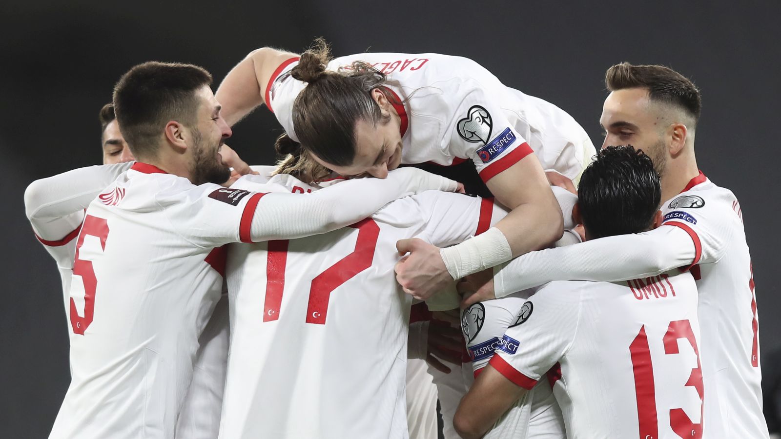 epa09094378 Hakan Calhanoglu of Turkey celebrates with team mates after scoring a goal during the FIFA World Cup 2022 qualification match between Turkey and the Netherlands in Istanbul, Turkey, 24 March 2021.  EPA/Tolga Bozoglu / POOL