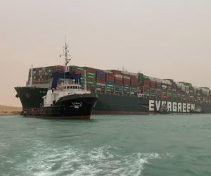 epa09092803 A handout photo made available by Media for the Suez Canal Head Office shows Egypt's Suez Canal blocked by a large container ship in Cairo, Egypt, 24 March 2021. A large container ship registered in Panama ran aground in the Suez Canal on 23 March, blocking passage of other ships and causing a traffic jam for cargo vessels.  EPA/Media Suez Canal Head Office / H  HANDOUT EDITORIAL USE ONLY/NO SALES