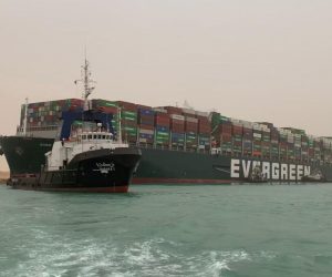 epa09092803 A handout photo made available by Media for the Suez Canal Head Office shows Egypt's Suez Canal blocked by a large container ship in Cairo, Egypt, 24 March 2021. A large container ship registered in Panama ran aground in the Suez Canal on 23 March, blocking passage of other ships and causing a traffic jam for cargo vessels.  EPA/Media Suez Canal Head Office / H  HANDOUT EDITORIAL USE ONLY/NO SALES