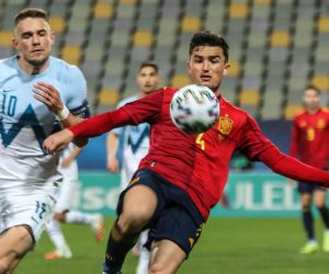 epa09094610 Timi Max Elsnik of Slovenia (L) in action against Hugo Guillamon of Spain (R) during the UEFA European Under-21 Championship match between Slovenia and Spain in Maribor, Slovenia, 24 March 2021.  EPA/SANDI FISER