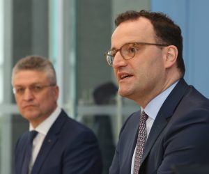 epa09098754 German Health Minister Jens Spahn (R) and Robert Koch Institute President Lothar Wieler (L) attend a news conference about the spread of the coronavirus (COVID-19) pandemic in Germany as the Easter holiday approaches, in Berlin, Germany, 26 March 2021. Spahn warned of a possible collapse of Germany's health system by April in the light of signs of a third wave of the coronavirus pandemic.  EPA/ADAM BERRY / POOL