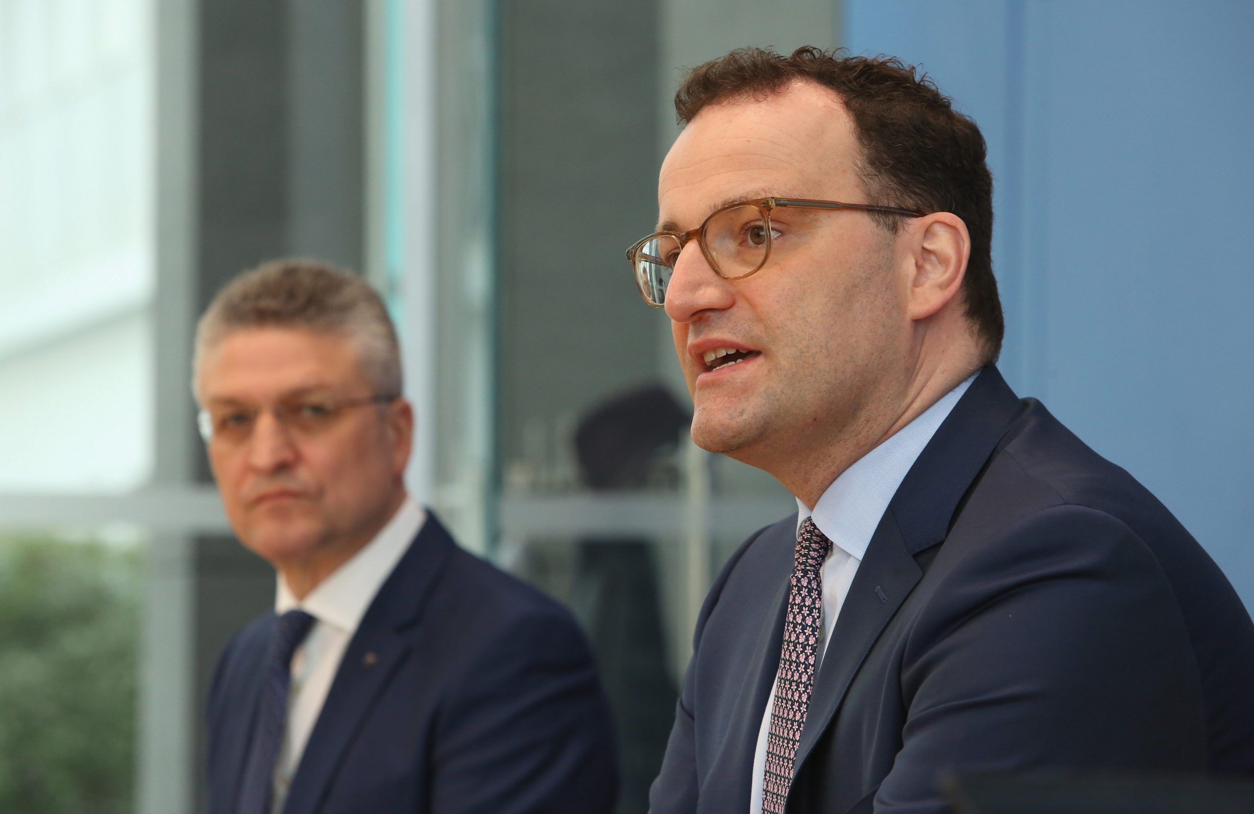 epa09098754 German Health Minister Jens Spahn (R) and Robert Koch Institute President Lothar Wieler (L) attend a news conference about the spread of the coronavirus (COVID-19) pandemic in Germany as the Easter holiday approaches, in Berlin, Germany, 26 March 2021. Spahn warned of a possible collapse of Germany's health system by April in the light of signs of a third wave of the coronavirus pandemic.  EPA/ADAM BERRY / POOL