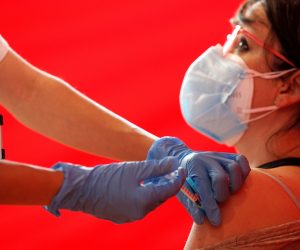 epa09099960 A health worker injects a dose of the AstraZeneca vaccine against COVID19 to a teacher, in Valencia, eastern Spain, 26 March 2021. Spain resumed the use of this vaccine after a 10-day-long pause in its administration after reports stated the vaccine could be associated with an increase in the risk of blood clotting disorders, doubts that were finally ruled out by the European Union's medicines regulator that declared the vaccine as safe.  EPA/Manuel Bruque