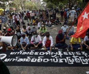 epa09100782 Demonstrators displaying a banner that says 'Anti-fascist Day' during a protest against the military coup in Yangon, Myanmar, 27 March 2021. Anti-coup protests continue as Myanmar's junta held a military parade in a major show of strength for the annual Armed Forces Day on 27 March in Naypyitaw.  EPA/STRINGER