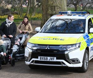 epa09100767 A police vehicle drives through St. James's Park in London, Britain, 27 March 2021. The UK is set to begin its first phase of easing lockdown restrictions from 29 March. The rule of six will apply again for people meeting in parks and private gardens. The UK has been marking a year since lockdown restrictions began on 23 March 2021.  EPA/ANDY RAIN
