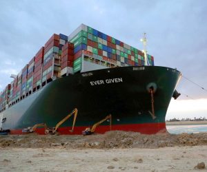 epa09103013 A handout photograph made available by the Suez Canal Authority, shows floatation work being carried out on the Ever Given container ship which ran aground in the Suez Canal, Egypt, 28 March 2021. The Ever Given, a large container ship ran aground in the Suez Canal on 23 March, blocking passage of other ships and causing a traffic jam for cargo vessels. The head of the Suez Canal Authority announced  on 28 March that efforts for the floatation of the Ever Given are continuing. Its floatation is being carried out by 14 tugboats that are towing and pushing the grounding vessel, it has on 27 March moved by two inches and the authorities hope that the ship will move further after the water starts running underneath it.  EPA/SUEZ CANAL AUTHORITY /HO HANDOUT   EDITORIAL USE ONLY NO SALES HANDOUT EDITORIAL USE ONLY/NO SALES