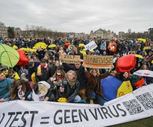 epa09103000 People take part in a so-called coffee drink campaign against the coronavirus measures on the Museumplein in Amsterdam, the Netherlands, 28 March 2021.  EPA/JEROEN JUMELET