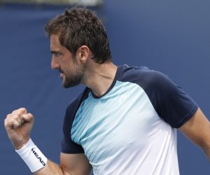 epa09105300 Marin Cilic of Croatia reacts against Lorenzo Musetti of Italy during their Men's singles match at the Miami Open tennis tournament in Miami Gardens, Florida, USA, 29 March 2021.  EPA/RHONA WISE
