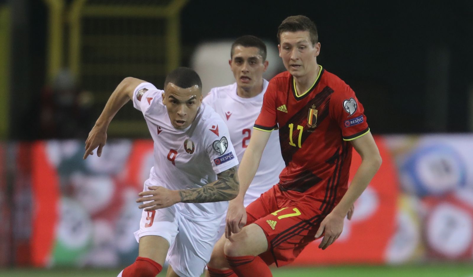 epa09107384 Belarus' Max Ebong Ngome (L) in action against Belgium's Hans Vanaken (R) during the FIFA World Cup 2022 qualifying soccer match between Belgium and Belarus in Leuven, Belgium, 30 March 2021.  EPA/Olivier Hoslet