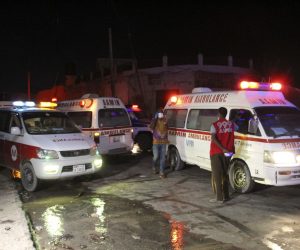 epa09055082 Ambulances on the scene of a suicide bomb blast outside the popular Lul Yemeni restaurant in Mogadishu, Somalia, 05 March 2021. According to the director of Mogadishu's Aamin ambulance service, Abdikadir Abdirahman, 20 people were killed and 30 others were wounded in the blast set off by a suicide bomber in a vehicle loaded with explosives. The attack has been claimed by Al-Shabaab a terrorist group linked to Al-Qaeda.  EPA/SAID YUSUF WARSAME