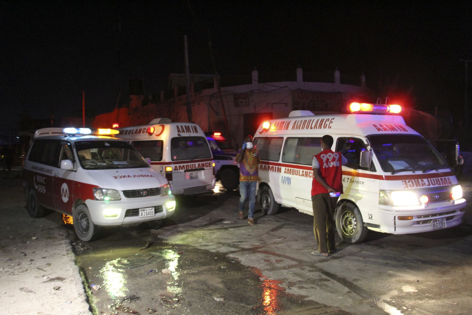 epa09055082 Ambulances on the scene of a suicide bomb blast outside the popular Lul Yemeni restaurant in Mogadishu, Somalia, 05 March 2021. According to the director of Mogadishu's Aamin ambulance service, Abdikadir Abdirahman, 20 people were killed and 30 others were wounded in the blast set off by a suicide bomber in a vehicle loaded with explosives. The attack has been claimed by Al-Shabaab a terrorist group linked to Al-Qaeda.  EPA/SAID YUSUF WARSAME