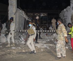 epa09055085 Somalia security forces investigate the scene of a suicide bomb blast outside the popular Lul Yemeni restaurant in Mogadishu, Somalia, 05 March 2021. According to the director of Mogadishu's Aamin ambulance service, Abdikadir Abdirahman, 20 people were killed and 30 others were wounded in the blast set off by a suicide bomber in a vehicle loaded with explosives. The attack has been claimed by Al-Shabaab a terrorist group linked to Al-Qaeda.  EPA/SAID YUSUF WARSAME