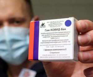 epa09063696 A pharmacist holds a packet of Sputnik V vaccines to be used for the second dose in the pharmacy of the Borsod-Abauj-Zemplen County Medical Center and University Teaching Hospital in Miskolc, Hungary, 09 March 2021.  EPA/JANOS VAJDA HUNGARY OUT