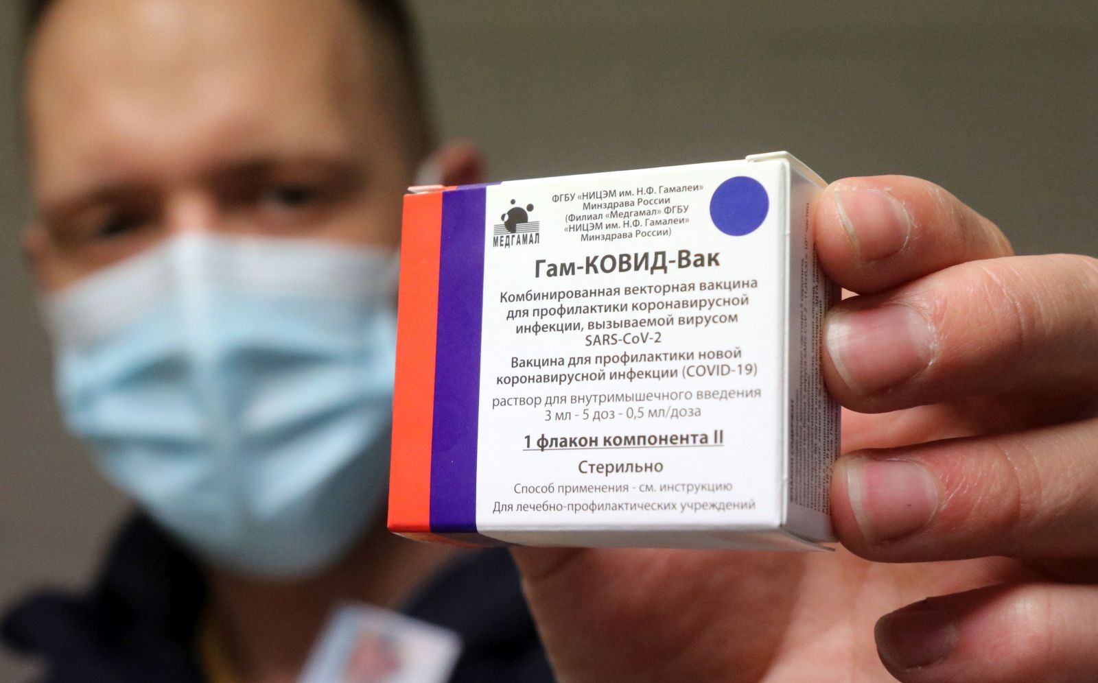 epa09063696 A pharmacist holds a packet of Sputnik V vaccines to be used for the second dose in the pharmacy of the Borsod-Abauj-Zemplen County Medical Center and University Teaching Hospital in Miskolc, Hungary, 09 March 2021.  EPA/JANOS VAJDA HUNGARY OUT