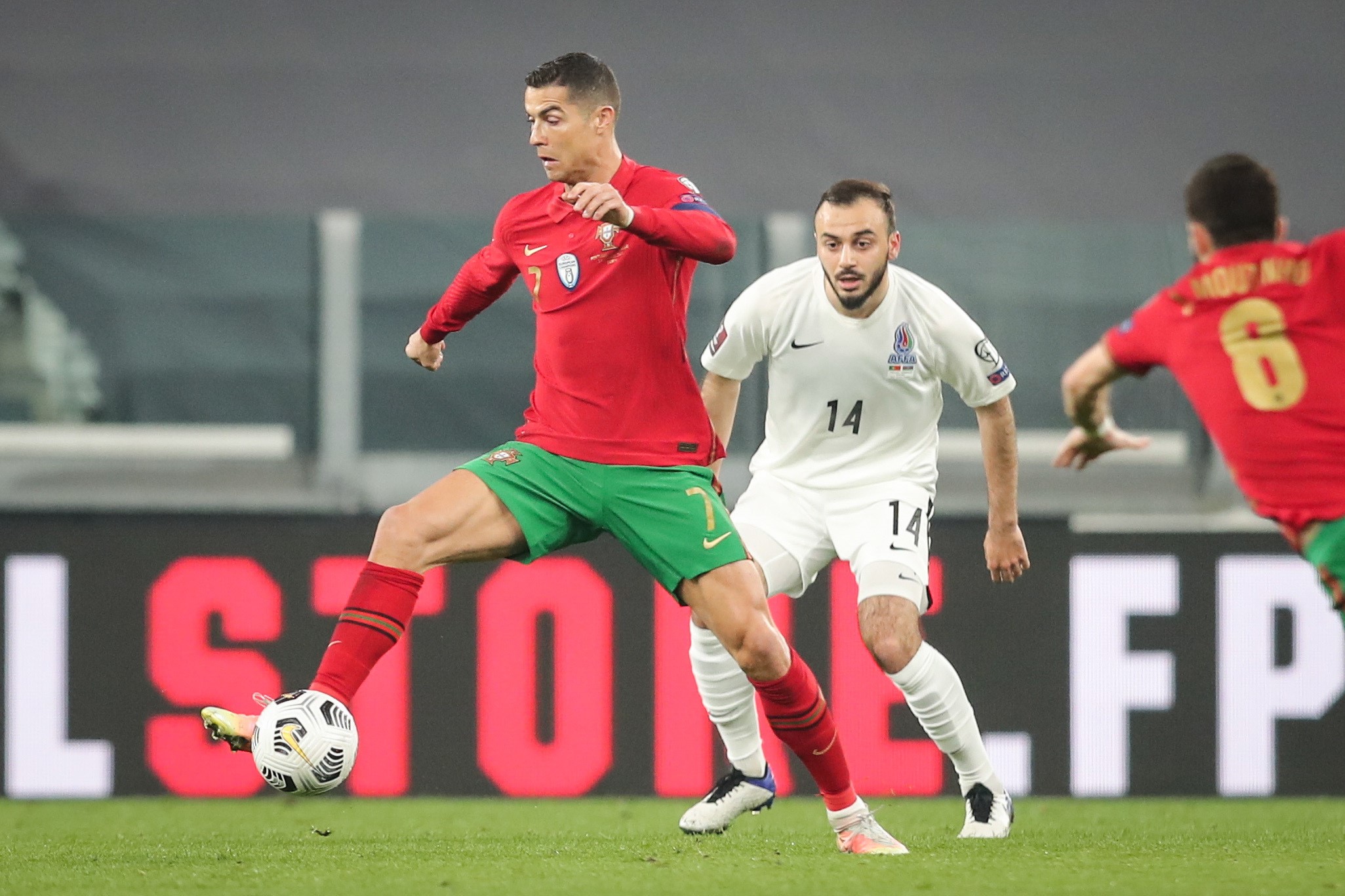epa09094722 Portugal's Cristiano Ronaldo (L) fights for the ball with Azerbaijan's Elvin Badalov during the FIFA World Cup Qatar 2022 Group A qualifier match Portugal against Azerbaijan in Turin, Italy, 24 March 2021.  EPA/MIGUEL A. LOPES