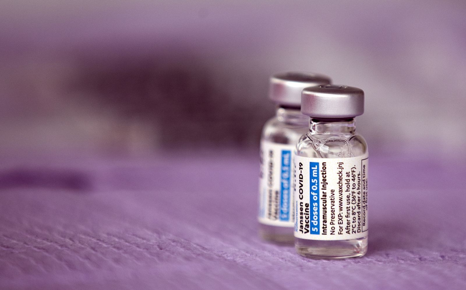 epa09097507 Vials of the Janssen (Pharmaceutical Companies of Johnson & Johnson) vaccine against Covid-19 are displayed during a vaccination operation organized by St. John's Well Child and Family Center in Los Angeles, California, USA, 25 March 2021. St. John's Well Child and Family Center, the Los Angeles County Federation of Labor and immigrant rights groups organized a press conference prior to the vaccination operation to call for immigrants, including undocumented people, to be prioritized in the COVID-19 vaccine rollout. About 400 immigrant community members will be receiving their COVID-19 vaccines throughout the day at the site.  EPA/ETIENNE LAURENT