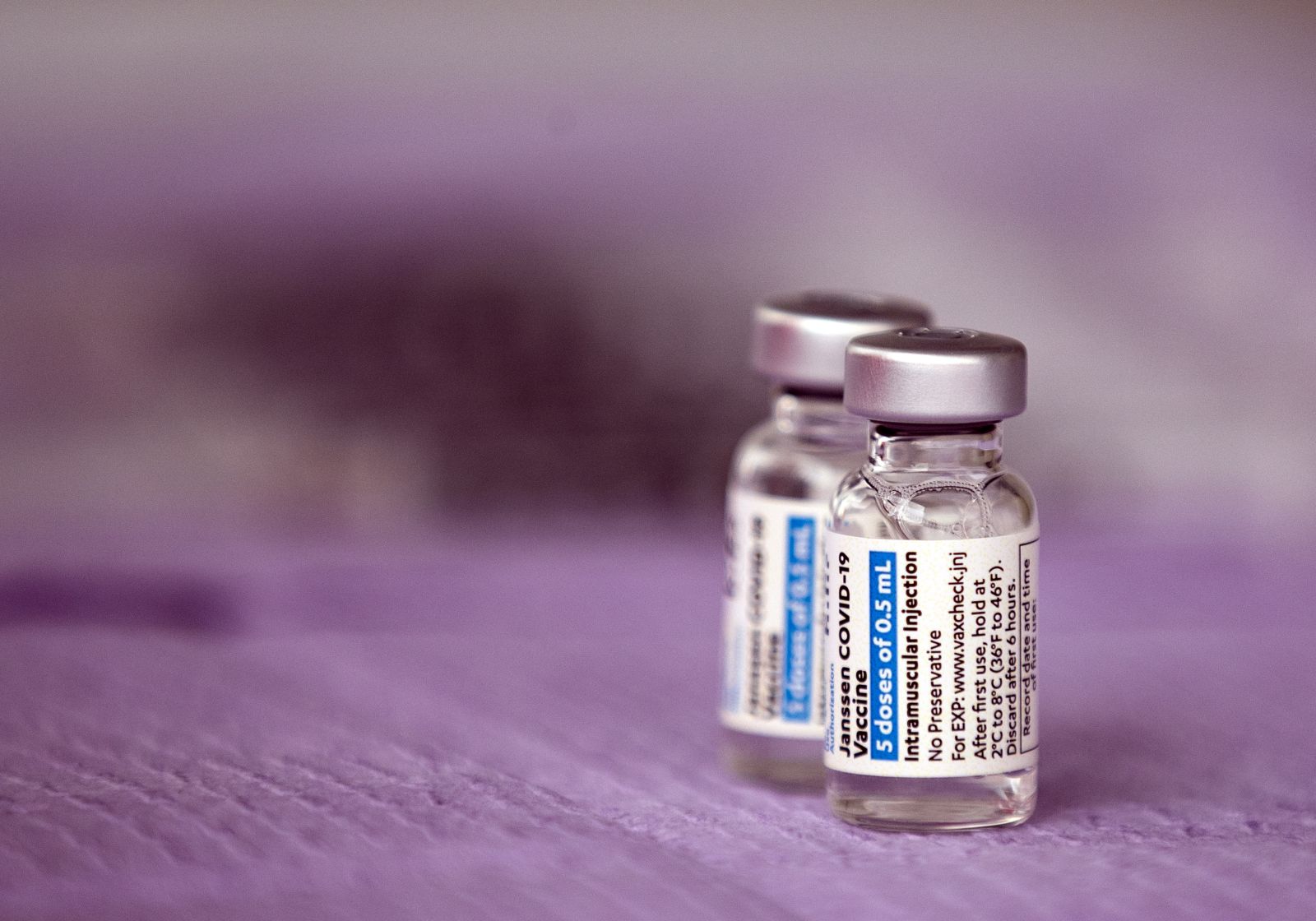 epa09097507 Vials of the Janssen (Pharmaceutical Companies of Johnson & Johnson) vaccine against Covid-19 are displayed during a vaccination operation organized by St. John's Well Child and Family Center in Los Angeles, California, USA, 25 March 2021. St. John's Well Child and Family Center, the Los Angeles County Federation of Labor and immigrant rights groups organized a press conference prior to the vaccination operation to call for immigrants, including undocumented people, to be prioritized in the COVID-19 vaccine rollout. About 400 immigrant community members will be receiving their COVID-19 vaccines throughout the day at the site.  EPA/ETIENNE LAURENT
