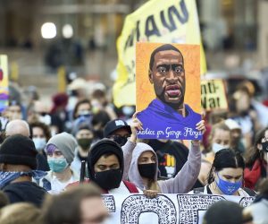 epa09105715 Protesters march through downtown Minneapolis on the first day of opening statements for the murder trial of former Minneapolis police officer Derek Chauvin who was charged in the death of George Floyd, in Minneapolis, Minnesota, USA, 29 March 2021.  EPA/CRAIG LASSIG