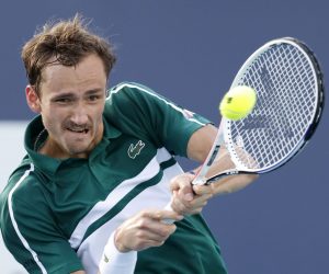 epa09107752 Daniil Medvedev of Russia in action against Frances Tiafoe of the USA during their Men's singles match at the Miami Open tennis tournament in Miami Gardens, Florida, USA, 30 March 2021.  EPA/RHONA WISE