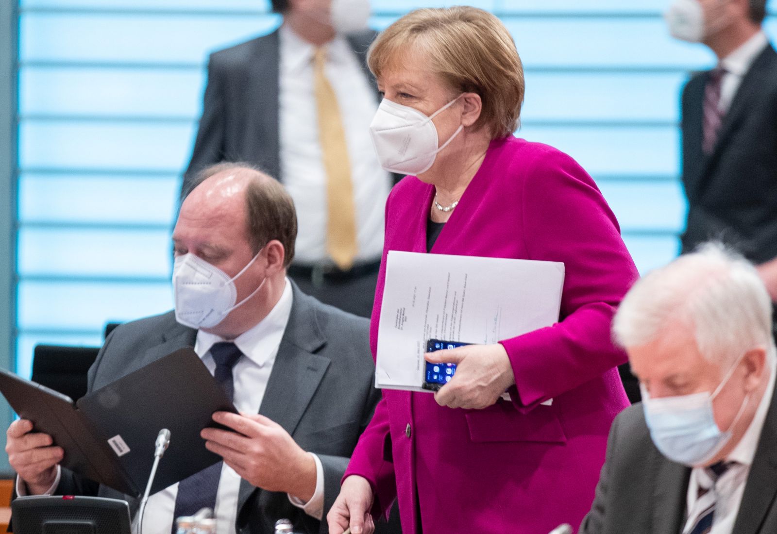 epa09108010 (L-R) Helge Braun, Head of the Federal Chancellery, German Chancellor Angela Merkel and Federal Minister of the Interior, Building and Community Horst Seehofer attend a cabinet meeting in Berlin, Germany, 31 March 2021.  EPA/ANDREAS GORA / POOL