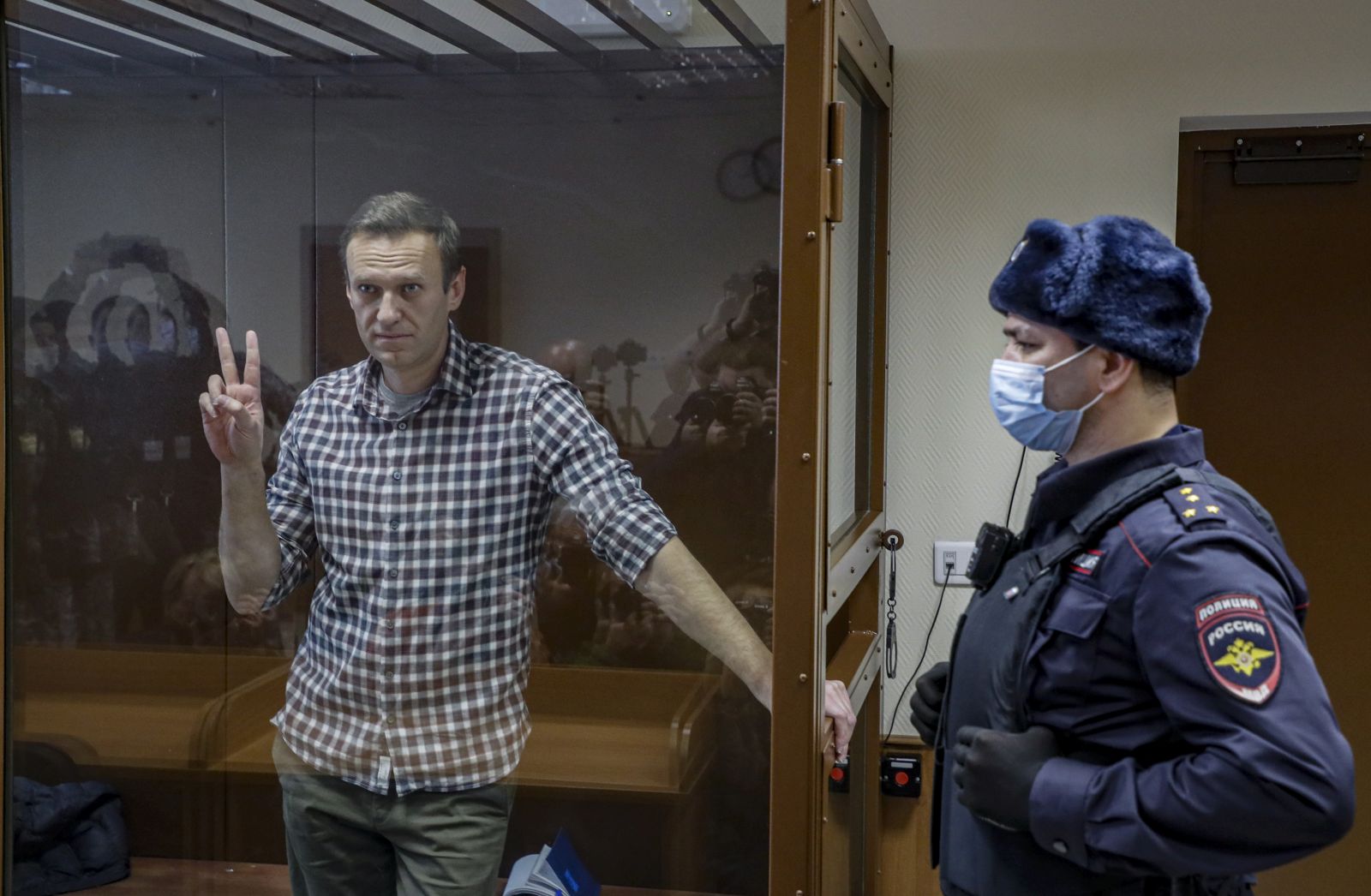 epa09108968 (FILE) Russian opposition leader Alexei Navalny gestures inside a glass cage prior to a hearing at the Babushkinsky District Court in Moscow, Russia, 20 February 2021 (reissued 31 March 2021). Russian opposition leader Alexei Navalny, who serves his 2,5 years sentence in a prison colony in the town of Pokrov in the Vladimir region, announced he is going on hunger strike in a protest of mistreatment in the prison.  EPA/YURI KOCHETKOV *** Local Caption *** 56711412