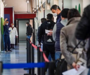 epa09110165 People wait in line at a new COVID-19 vaccination center inside the Museum of Capodimonte in Naples, Italy, 01 April 2021, on the first day of an inoculation campaign at the art museum. The hub at the Fagianeria del Bosco di Capodimonte is the fourth vaccination center established by the local health authorities ASL Napoli 1.  EPA/CESARE ABBATE