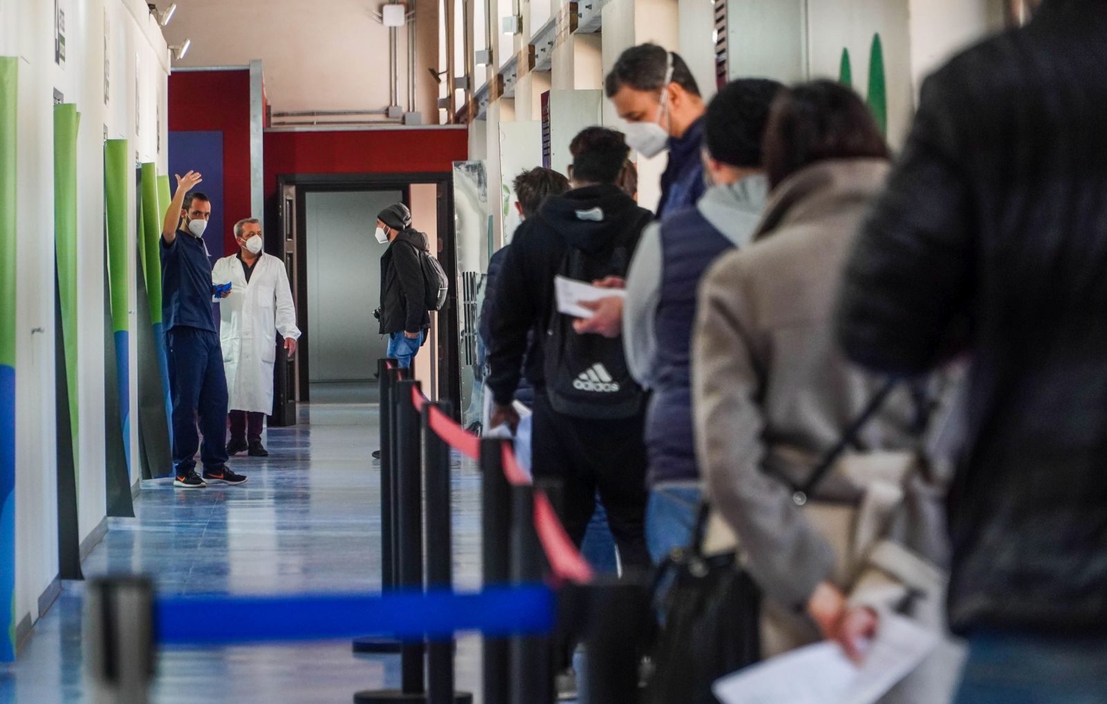 epa09110165 People wait in line at a new COVID-19 vaccination center inside the Museum of Capodimonte in Naples, Italy, 01 April 2021, on the first day of an inoculation campaign at the art museum. The hub at the Fagianeria del Bosco di Capodimonte is the fourth vaccination center established by the local health authorities ASL Napoli 1.  EPA/CESARE ABBATE