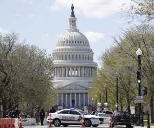 epa09112304 Police investigate at the scene afte a vehicle rammed a barricade outside the US Capitol and shots were fired according to reports in Washington, DC, 02 April 2021.  EPA/SHAWN THEW