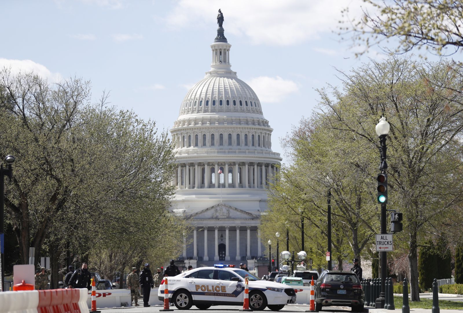 epa09112304 Police investigate at the scene afte a vehicle rammed a barricade outside the US Capitol and shots were fired according to reports in Washington, DC, 02 April 2021.  EPA/SHAWN THEW
