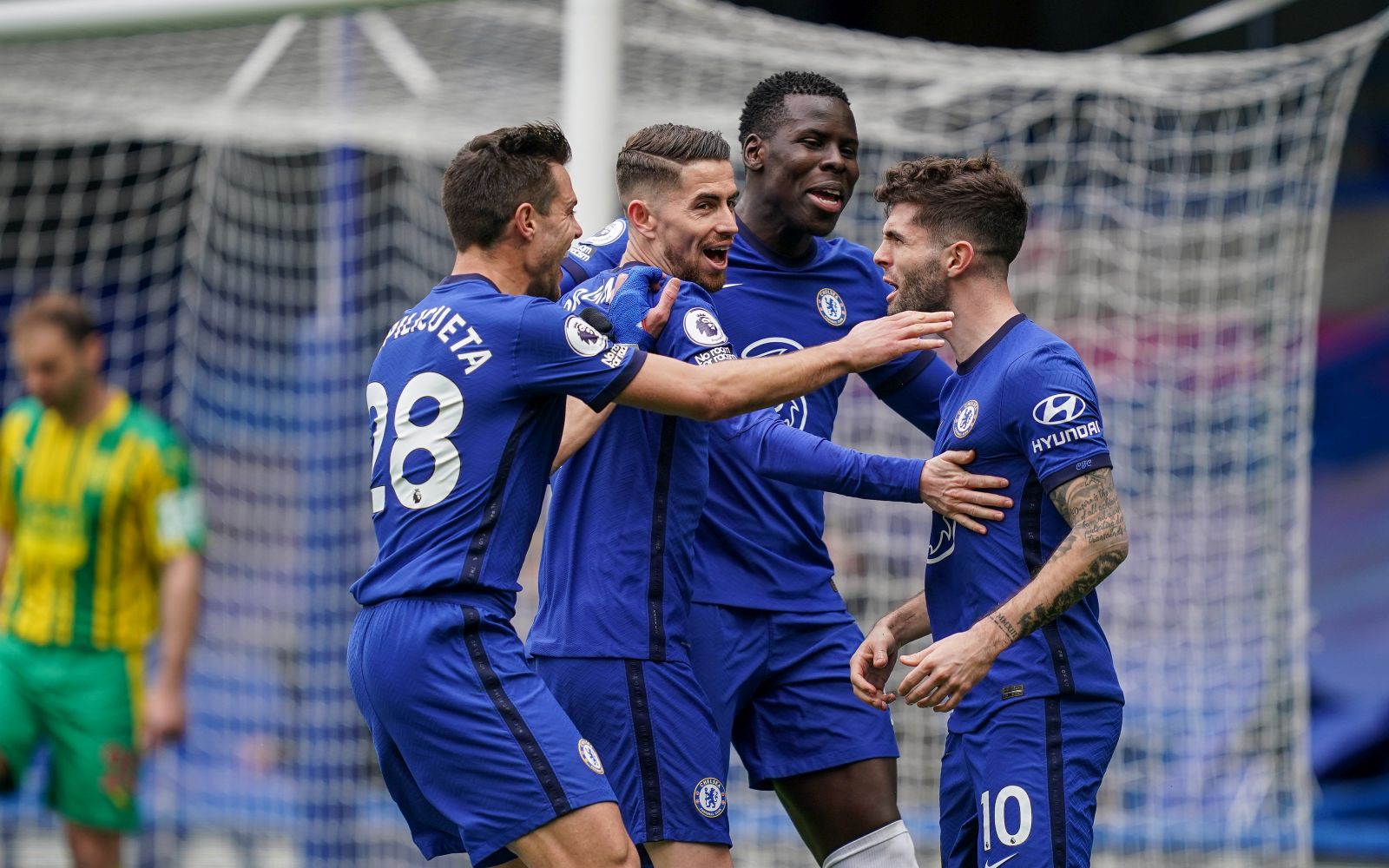 epa09112971 Christian Pulisic (R) of Chelsea celebrates with teammates after scoring a goal during the English Premier League soccer match between Chelsea FC and West Bromwich Albion in London, Britain, 03 April 2021.  EPA/John Walton / POOL EDITORIAL USE ONLY. No use with unauthorized audio, video, data, fixture lists, club/league logos or 'live' services. Online in-match use limited to 120 images, no video emulation. No use in betting, games or single club/league/player publications.