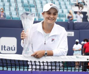 epa09114306 Ashleigh Barty of Australia holds the Butch Buchholz Trophy following her win against Bianca Andreescu of Canada following their Women's singles finals match at the Miami Open tennis tournament in Miami Gardens, Florida, USA, 03 April 2021.  EPA/RHONA WISE