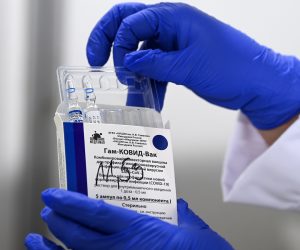 epa09120594 A nurse takes out vials of the Russian Sputnik V vaccine against Covid-19 during vaccination at the Arena 'Boris Trajkovski' in Skopje, North Macedonia, 05 April 2021 (reissued 07 April 2021). The prime minister of the German federal state Bavaria Soeder on 07 April 2021 said the state had signed a preliminary contract over a purchase of Russian COVID-19 vaccine Sputnik V. An approval for the vaccine by the European Medicines Agency (EMA) is pending.  EPA/GEORGI LICOVSKI *** Local Caption *** 56807518