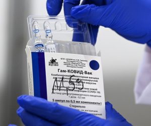 epa09120594 A nurse takes out vials of the Russian Sputnik V vaccine against Covid-19 during vaccination at the Arena 'Boris Trajkovski' in Skopje, North Macedonia, 05 April 2021 (reissued 07 April 2021). The prime minister of the German federal state Bavaria Soeder on 07 April 2021 said the state had signed a preliminary contract over a purchase of Russian COVID-19 vaccine Sputnik V. An approval for the vaccine by the European Medicines Agency (EMA) is pending.  EPA/GEORGI LICOVSKI *** Local Caption *** 56807518