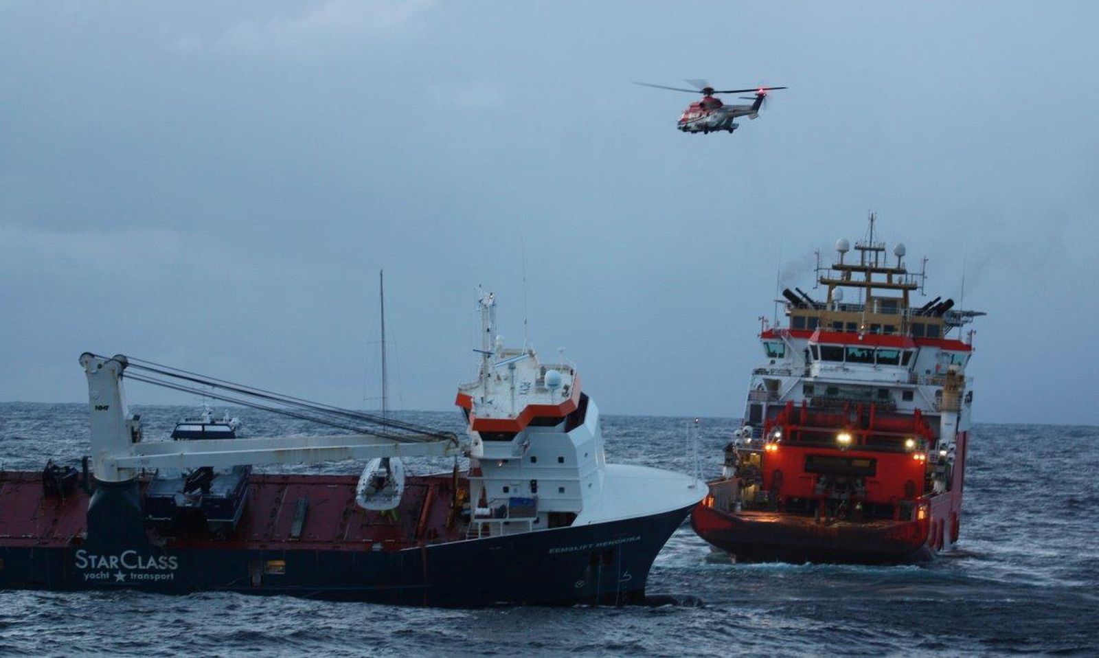 epa09121445 A handout photo made available by Norwegian Coast Guard shows Normand Drott tug boat as it begins to gently turn the Dutch general cargo ship Eemslift Hendrik adrift in the Noorwegian Sea, Norway, 07 April 2020. The Eemslift Hendrika made a distress call on 05 April, the twelve crew members were evacuated the same day. The plan is to tow the ship to Breisundet near Alesund for further examination.  EPA/KV BERGEN / NORWEGIAN COAST GUARD / HANDOUT  HANDOUT EDITORIAL USE ONLY/NO SALES